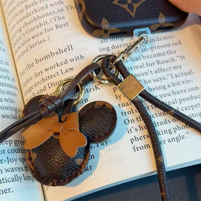 Luxury Monogram Case with Bow Charm & Wrist Lanyard 12-18 Pro & Pro Max
