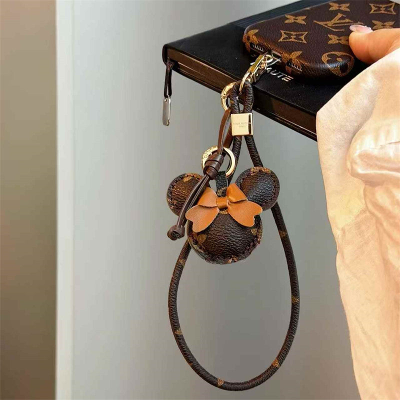 Luxury Monogram Case with Bow Charm & Wrist Lanyard 12-18 Pro & Pro Max